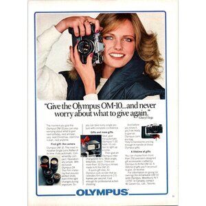 1981 Olympus OM-10 SLR Film Camera Vintage Print Ad Cheryl Tiegs 80s Wall Art